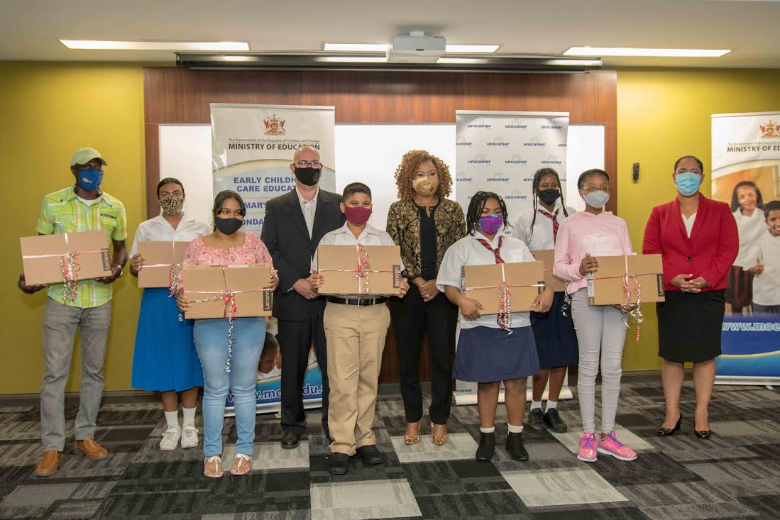 Unicomer Ltd donates eight laptops to top SEA students