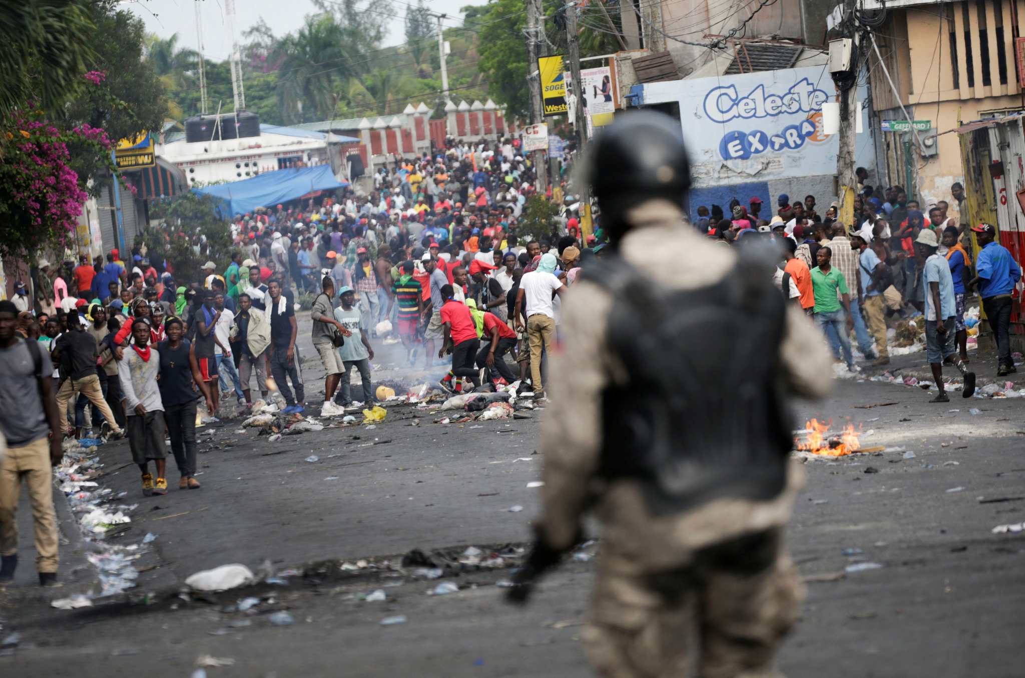 Anti-government protesters set fires in the capital of Haiti