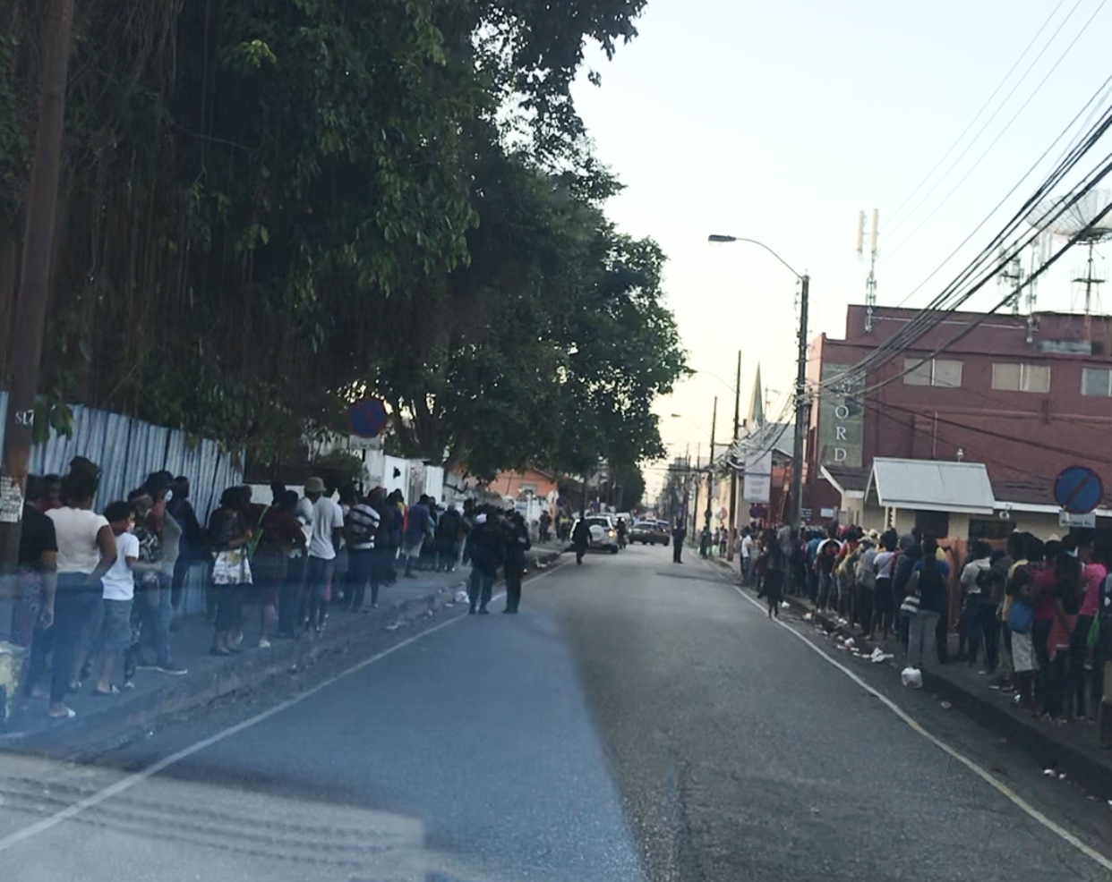 Hundreds line up outside Living Waters in POS for food bags