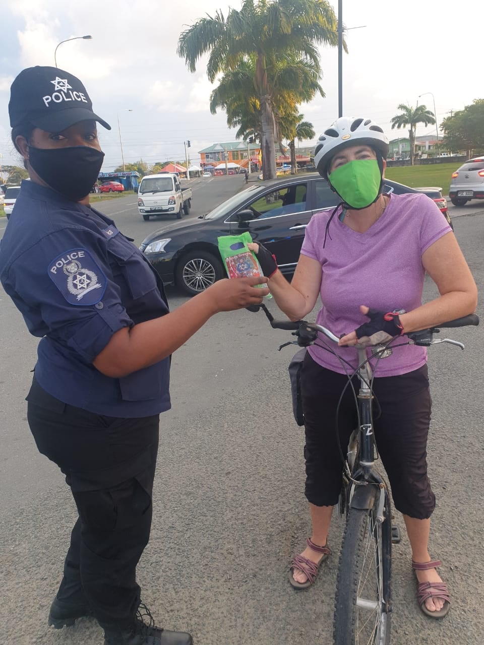Tobago officers reward citizens with tokens for masking up