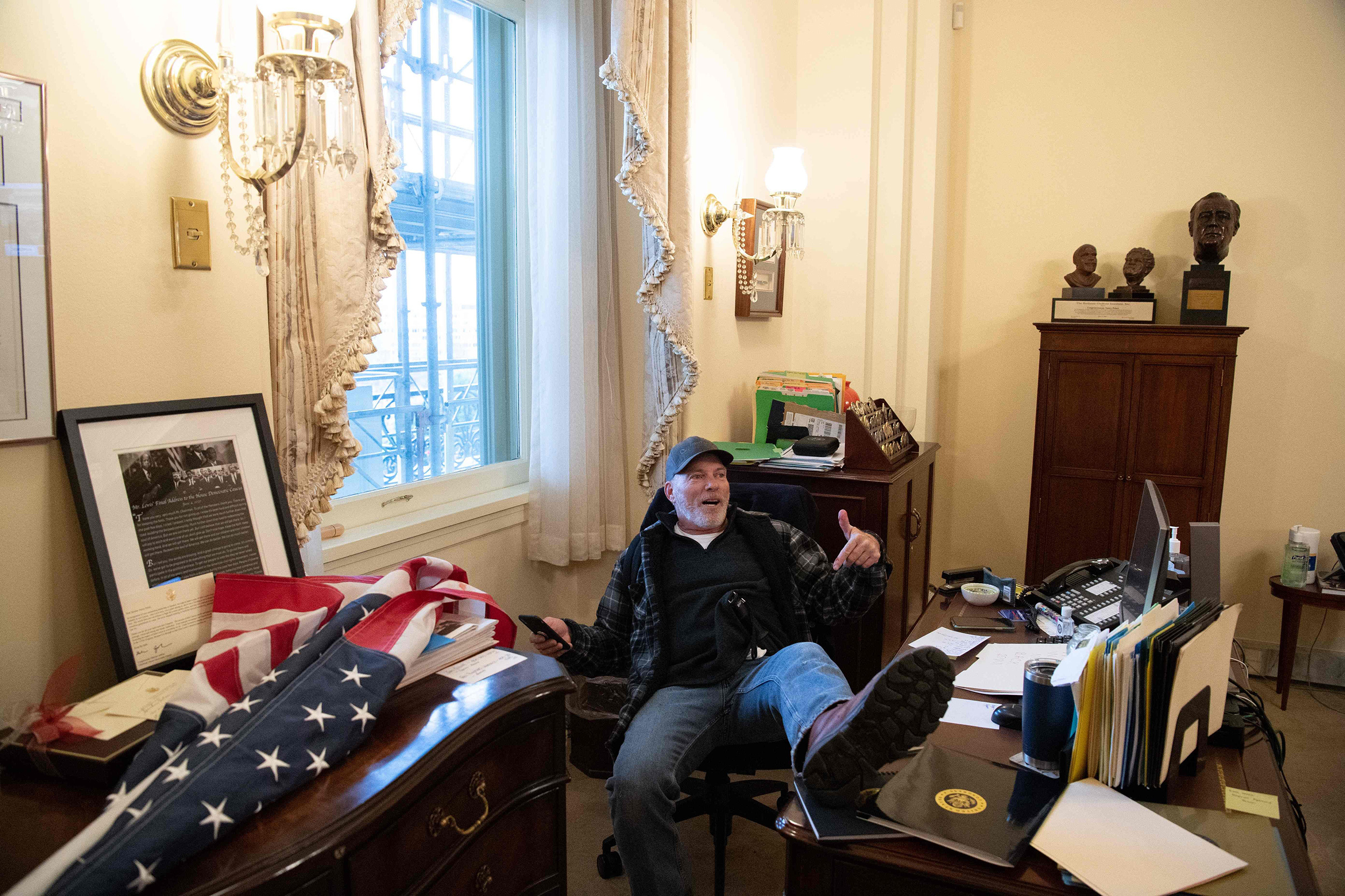 Man Photographed Sitting At A Desk In Pelosi’s Office Has Been Arrested