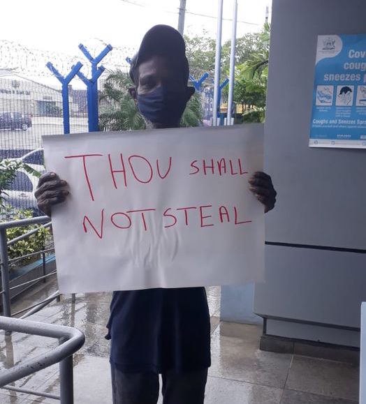 Man ordered to hold sign saying “Thou Shall Not Steal”