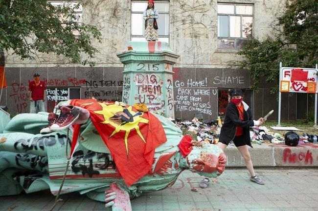 Activists topple Ryerson University statue in Toronto over troubled indigenous history