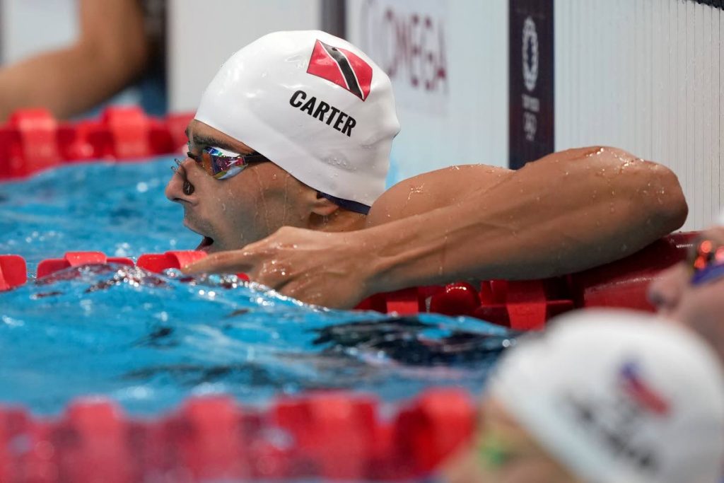 Carter finishes 2nd in new national record time, but fails to qualify for 100M fly semis