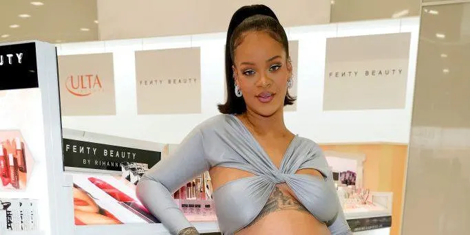 Rihanna stuns in silver crop top and long column skirt at Fenty Beauty launch