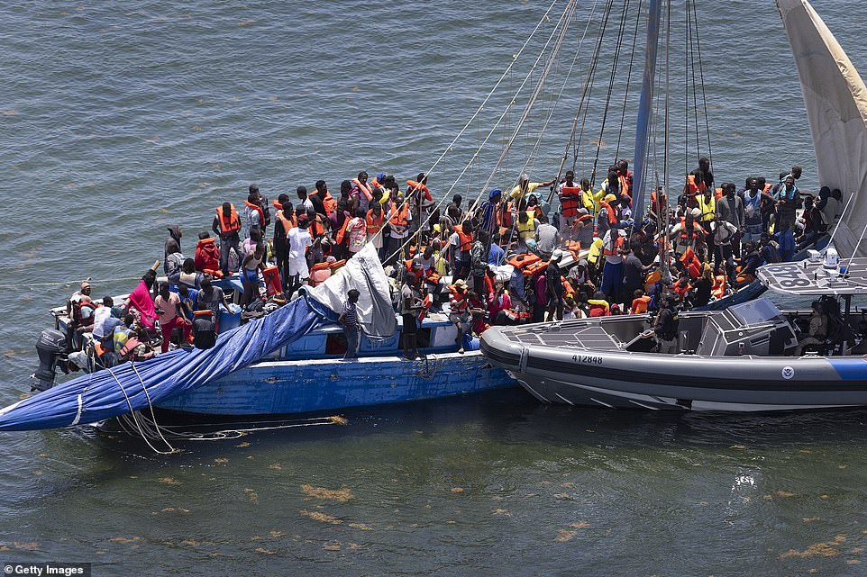 Over 200 Haitian migrants in custody after a sailboat appeared stranded off the Florida Keys