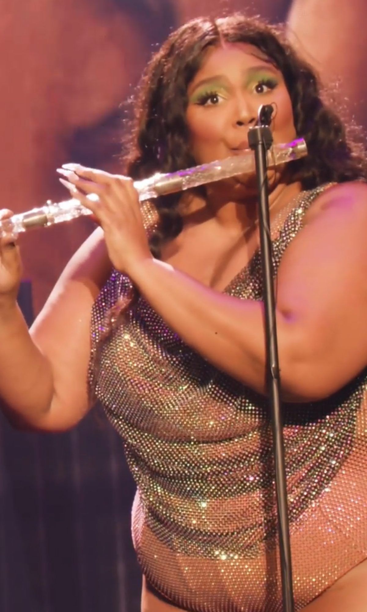 Lizzo plays 200 year old crystal flute on stage