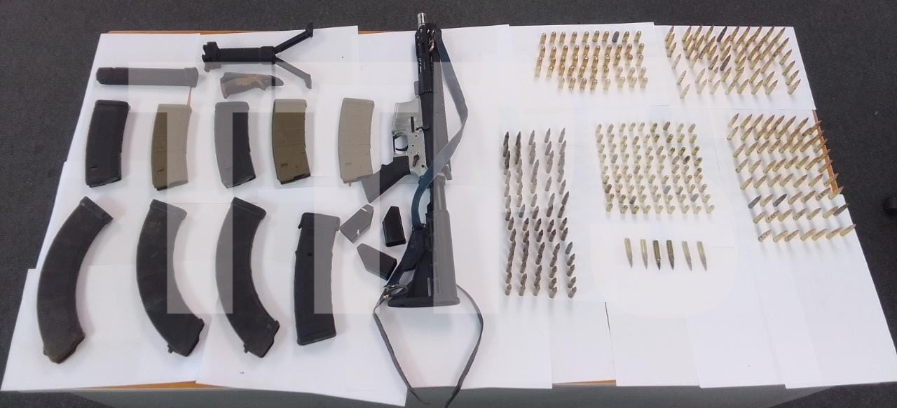 Cops seize high-powered rifle, 300 rounds of ammo & camouflage gear