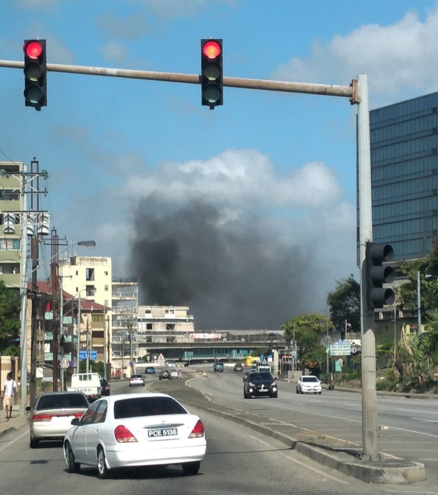 Independence Square HDC residents burn debris, block main road into POS