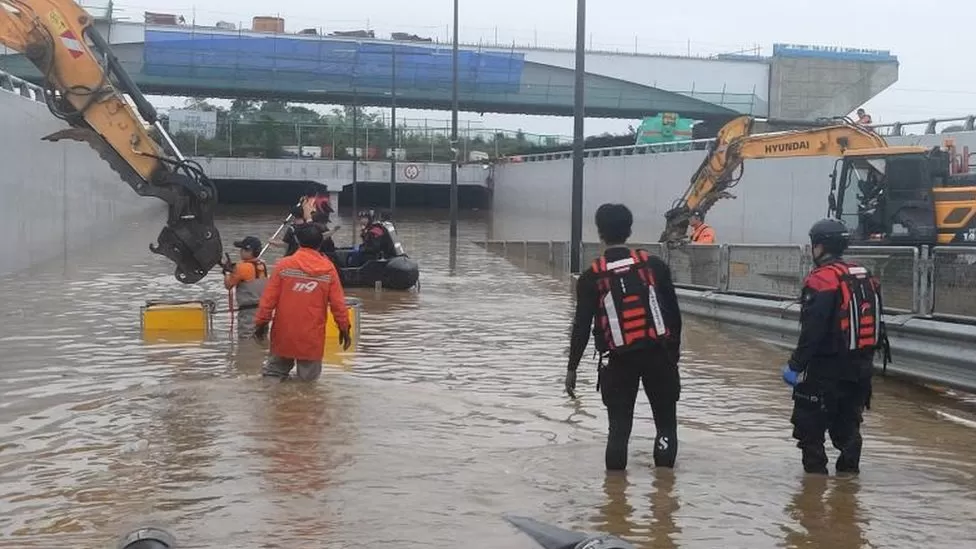 Dozens die in flooded tunnel and landslides in South Korea