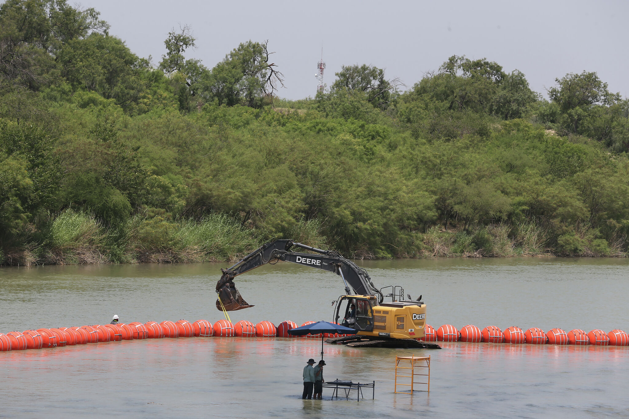 Biden administration sues Texas over floating barrier in Rio Grande river