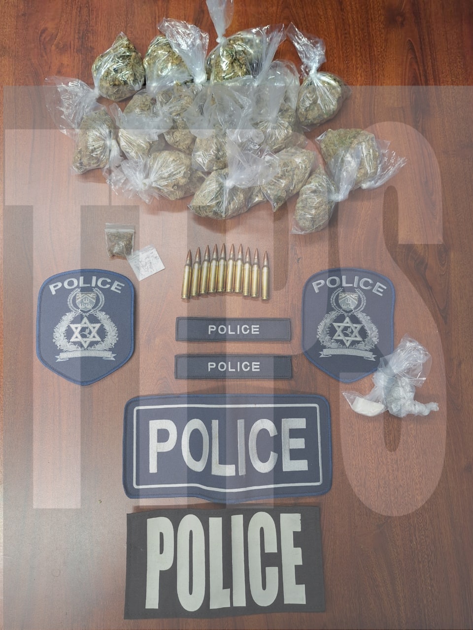 Cops hold 2; seize ammo, drugs and items with police insignia in Central